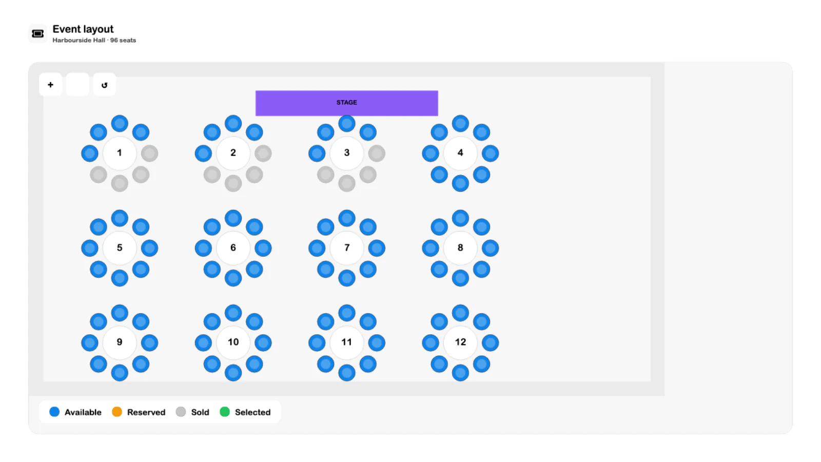 SRVZr event seating layout with twelve tables, numbered seats, and booking availability